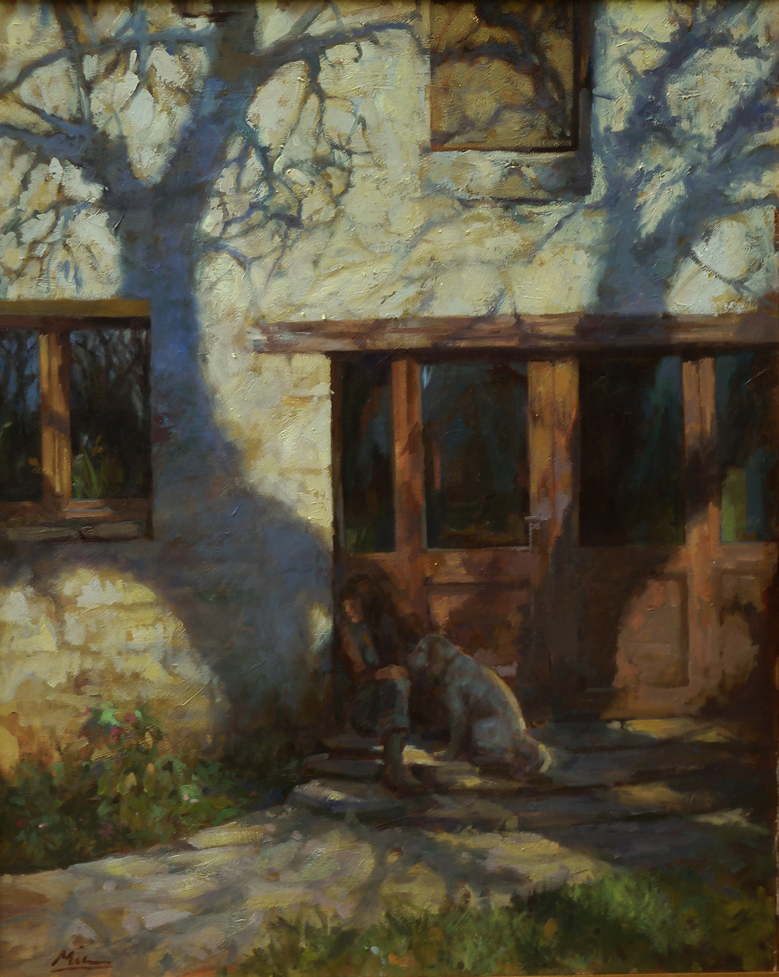 girl and a dog in the shadow of a tree.